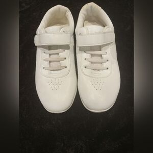 Pre- Loved  white sports shoes with velcro straps Step into comfort and style wi